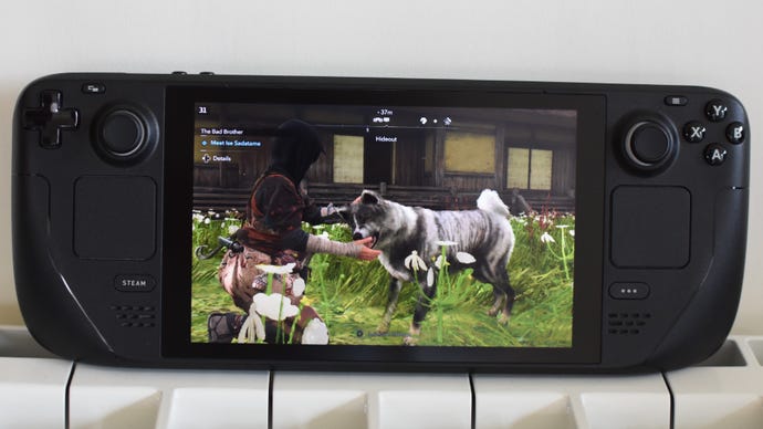 Naoe pets a dog in Assassin's Creed Shadows, running on a Steam Deck.