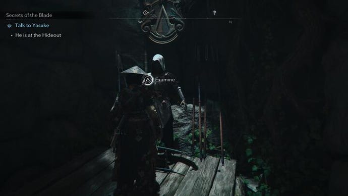 Naoe standing in front of a mannequin dressed in the Apprentice Assassin armor in Assassin's Creed Shadows.