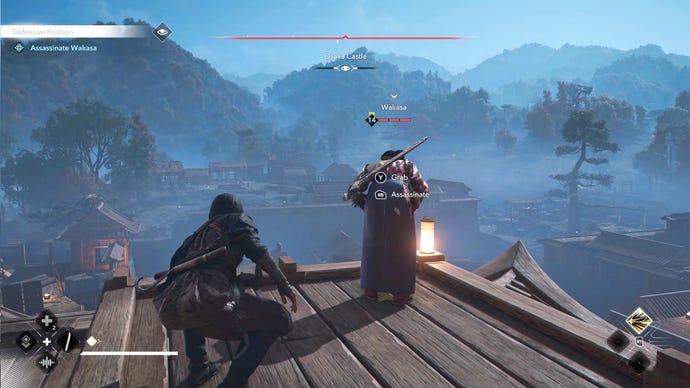 Naoe in Assassin's Creed Shadows sneaks up behind Wakasa atop a building rooftop while Wakasa looks over the edge to her soldiers below.