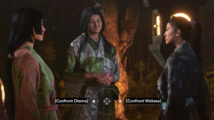 Three women stands in a group in a garden at night in Assassin's Creed Shadows. A dialogue option at the bottom of the screen prompts the player to choose between "Confront Otama" and "Confront Wakasa".