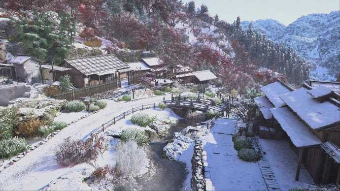 Winter snow covers several houses and country roads in Assassin's Creed Shadows.