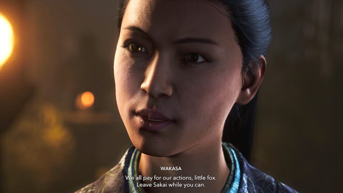 A close-up of Wakasa's face in Assassin's Creed Shadows as she threatens Naoe.
