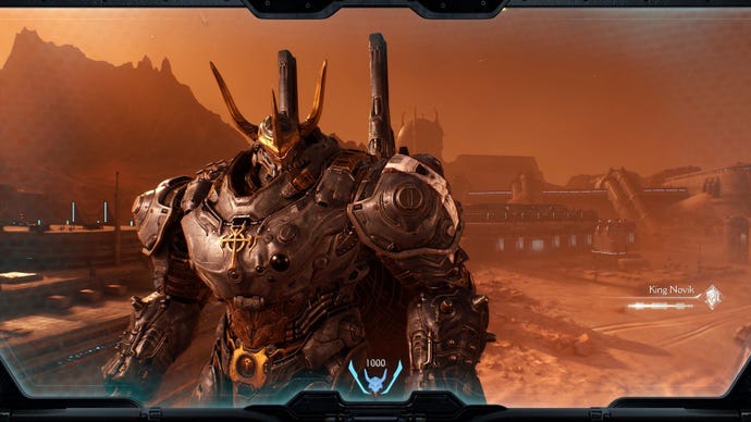The mech of an ally stands in front of the player's view, with bulky armour and an ornate helmet.