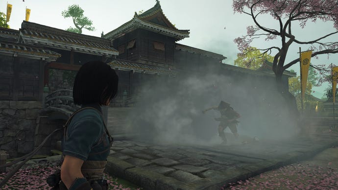 Naoe uses a smoke bomb to disorient an opponent in Assassin's Creed Shadows.