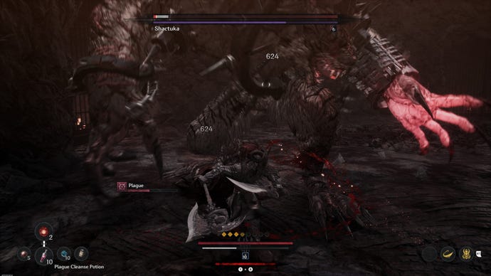 A demon stretches out his hand to grab the player during a boss fight.